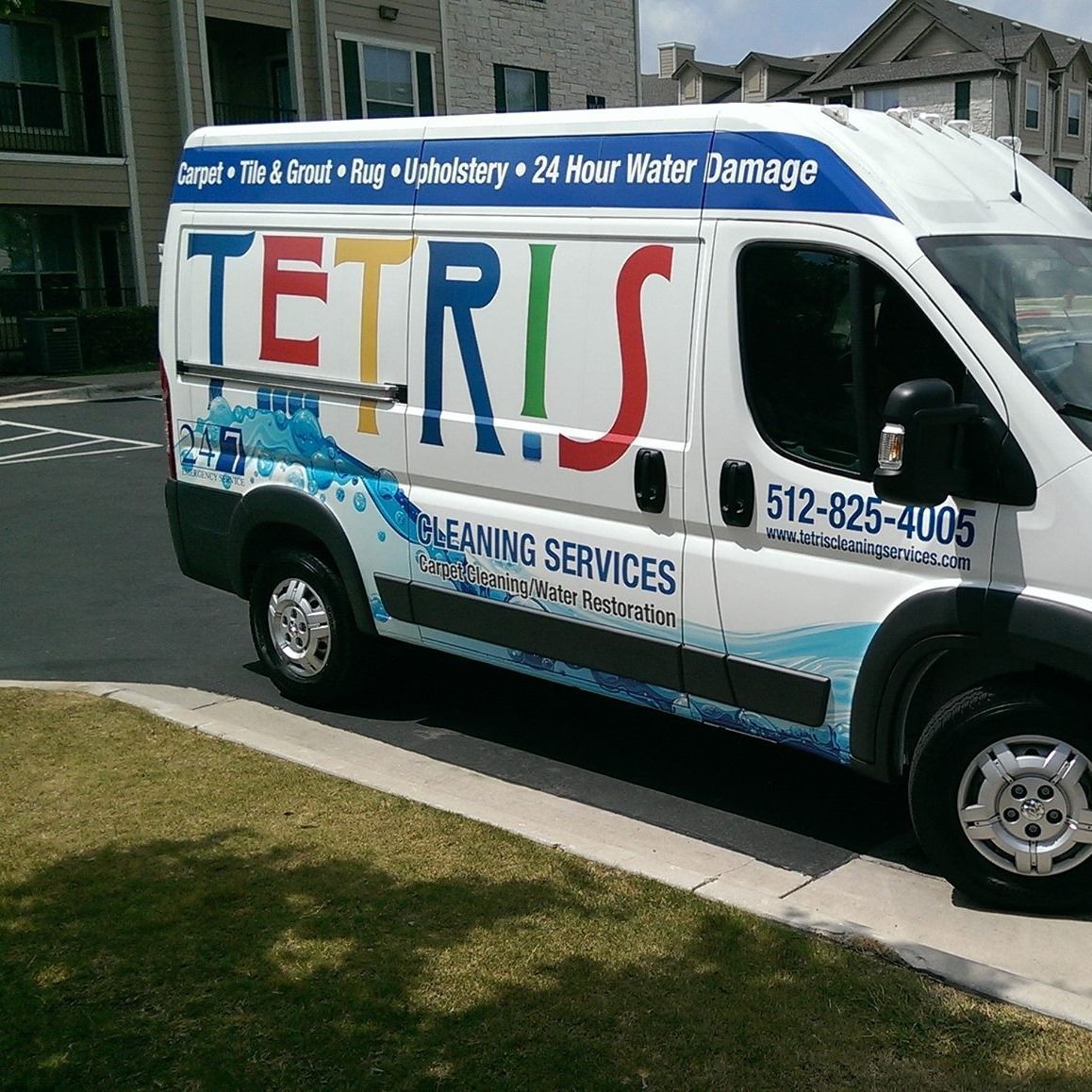 Tetris Cleaning Services van with the 24 hour water damage line on the side