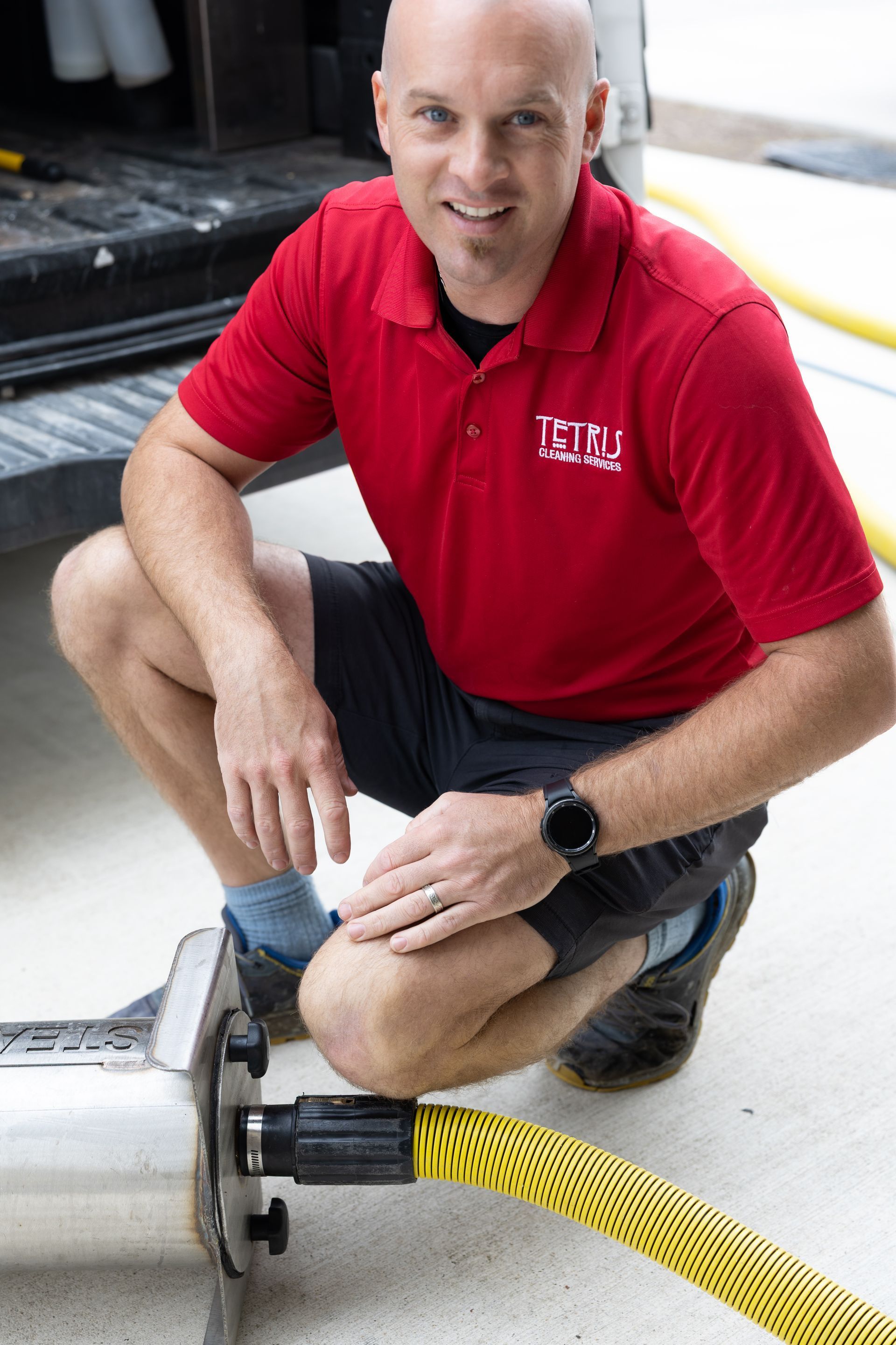 DJ Keegan, owner of Tetris Cleaning Services, in the red Tetris polo